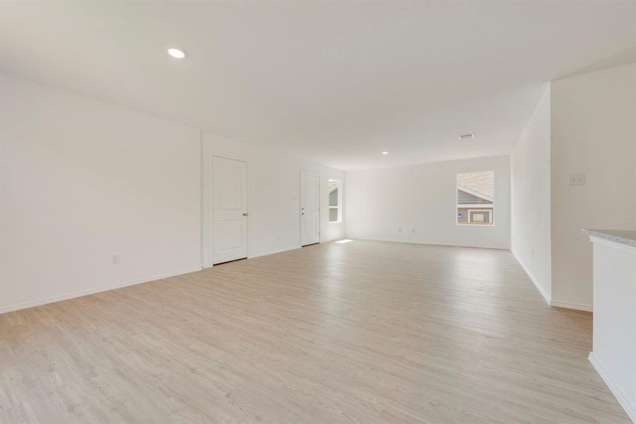 Unfurnished living room featuring light hardwood / wood-style floors