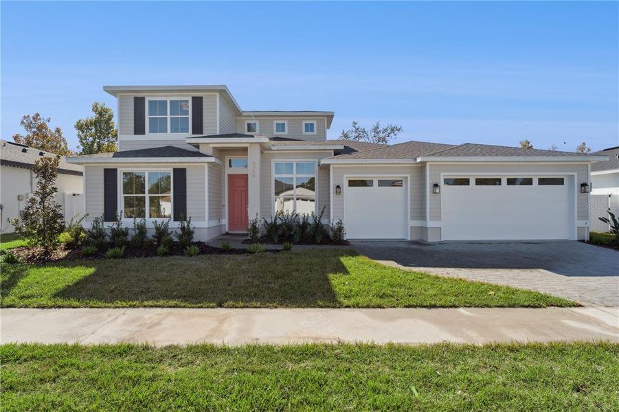 Front exterior of a new home in Eagles Landing, Orlando, FL, highlighting curb appeal (Image 1).