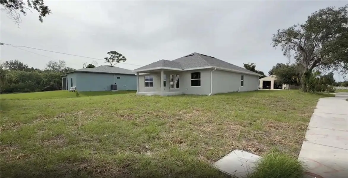 Exterior details and patio area of a home in , Port Charlotte (Image 3). Exterior details and patio area of a home in , Port Charlotte (Image 3).