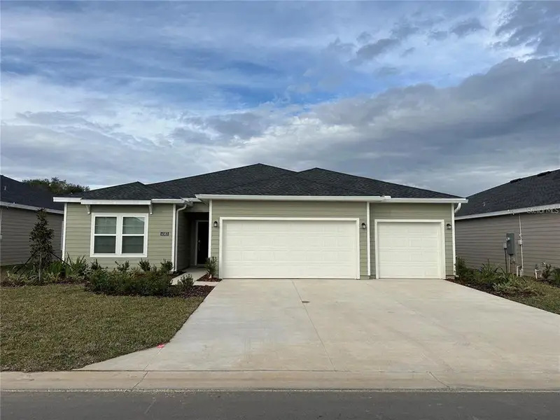 Front exterior of a new home in Pioneer Ranch, Ocala, FL, highlighting curb appeal (Image 1). Front exterior of a new home in Pioneer Ranch, Ocala, FL, highlighting curb appeal (Image 1).