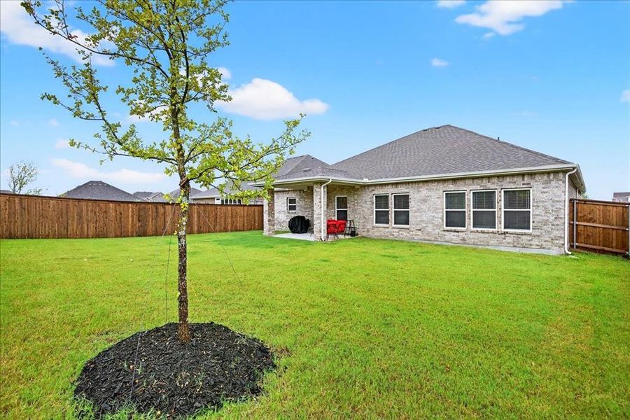 View of the back of house with a patio, a fenced backyard View of the back of house with a patio, a fenced backyard