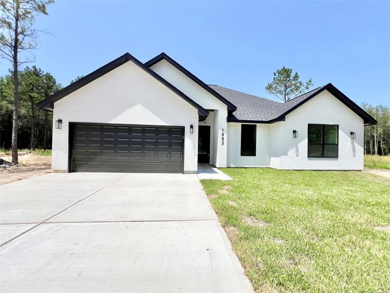 Front exterior of a new home in , Dayton, TX, highlighting curb appeal (Image 23).