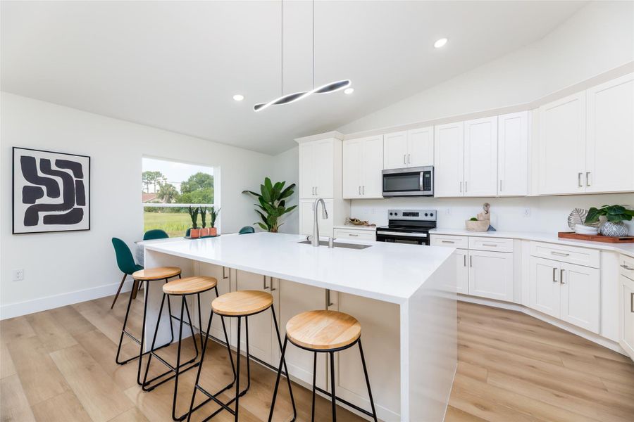 Spacious quartz waterfall island with cabinets on both sides—perfect for storage and entertaining!