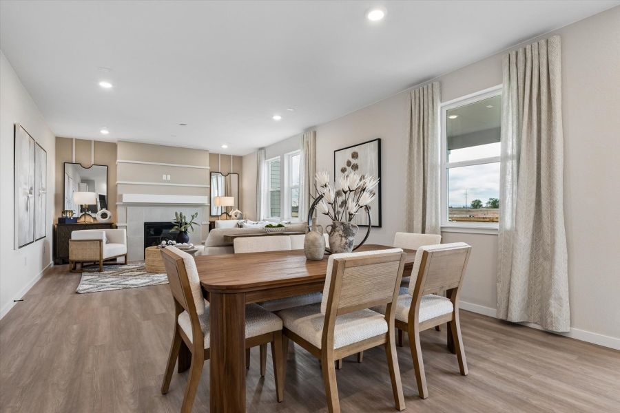 A dining room with a large table. A dining room with a large table.