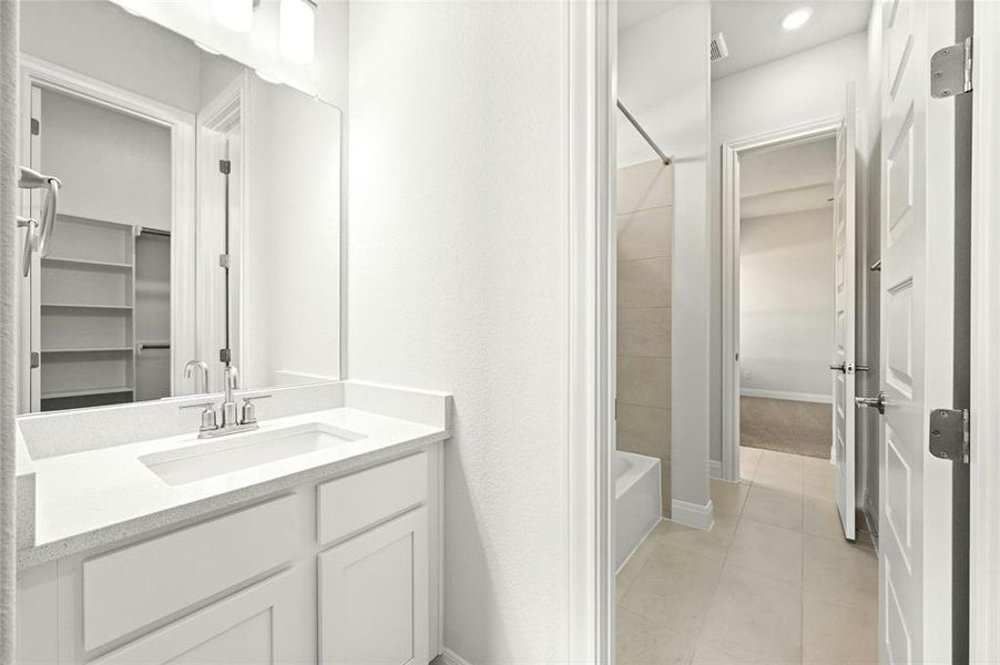 Jack and Jill bathroom with privacy sinks for each bedroom.