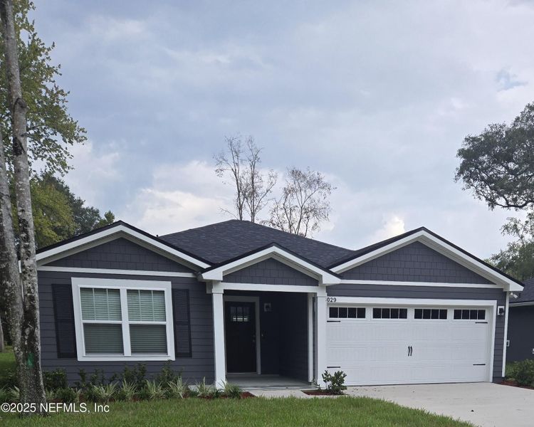 Front exterior of a new home in , Jacksonville, FL, highlighting curb appeal (Image 1).