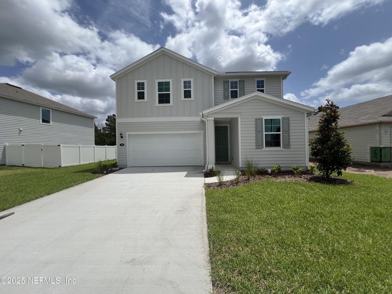 Front exterior of a new home in , Jacksonville, FL, highlighting curb appeal (Image 1). Front exterior of a new home in , Jacksonville, FL, highlighting curb appeal (Image 1).