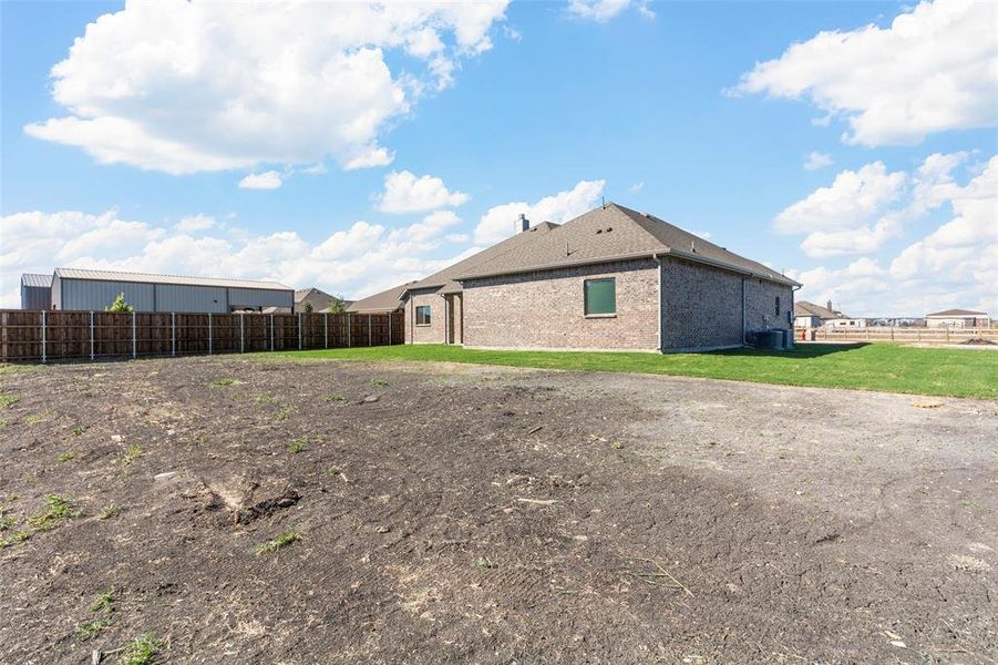 View of side of property with cooling unit