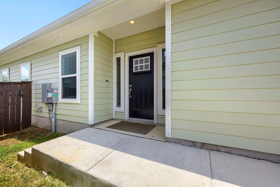 A welcoming entry, with a classic front door framed by sidelights, promises comfort within. A welcoming entry, with a classic front door framed by sidelights, promises comfort within.