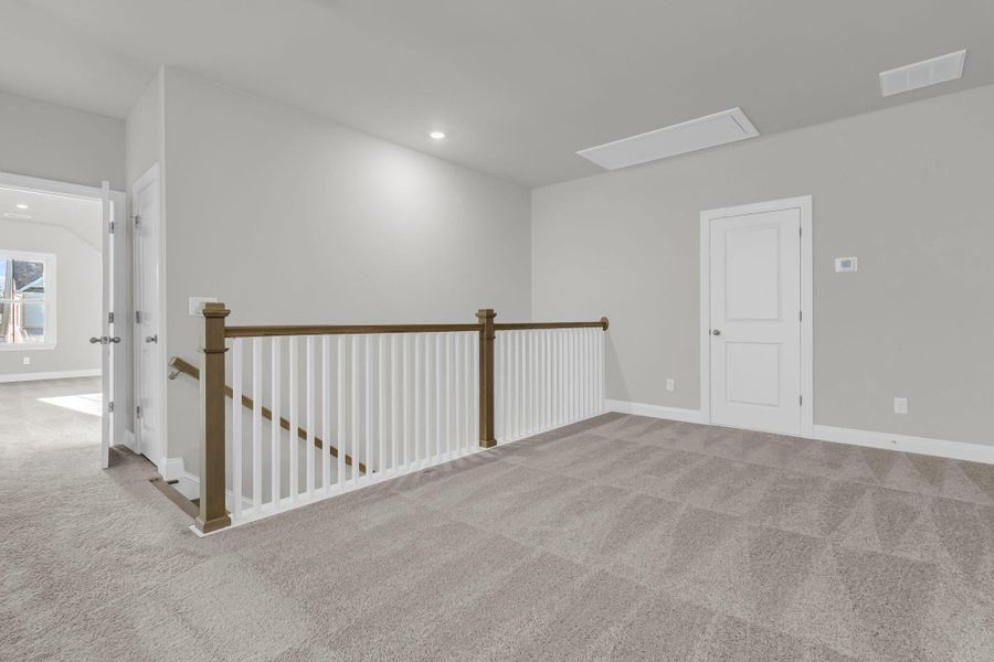 Spacious, unfurnished interior of a new home in Tidewater at Lakes of Cane Bay, Summerville (Image 19).