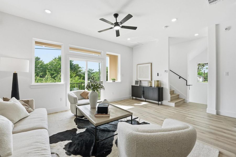 Abundance of windows and walk out patios bring natural light into the entire space.