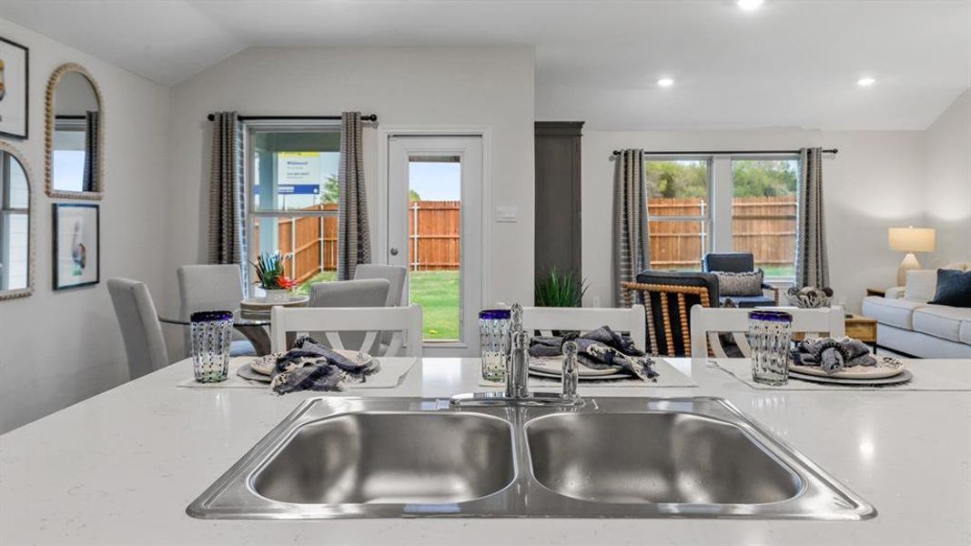 Kitchen with vaulted ceiling and open floor plan Kitchen with vaulted ceiling and open floor plan