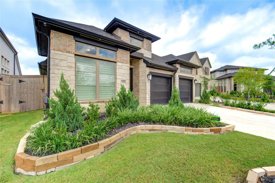 Front exterior of a new home in Cross Creek West, Fulshear, TX, highlighting curb appeal (Image 23).