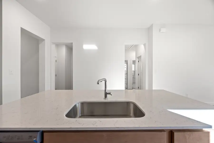 Kitchen in the Turquoise home plan by Trophy Signature Homes – REPRESENTATIVE PHOTO