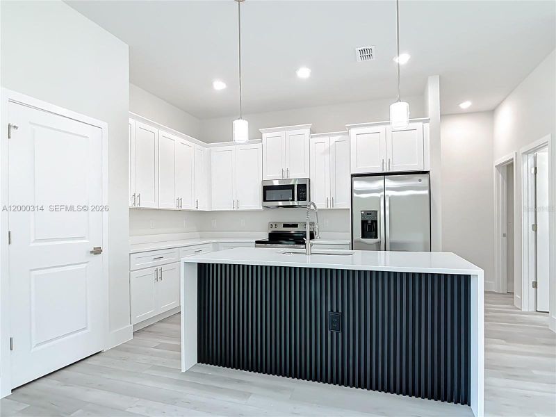 Furnished interior view inside a new home in , Port Charlotte (Image 4).
