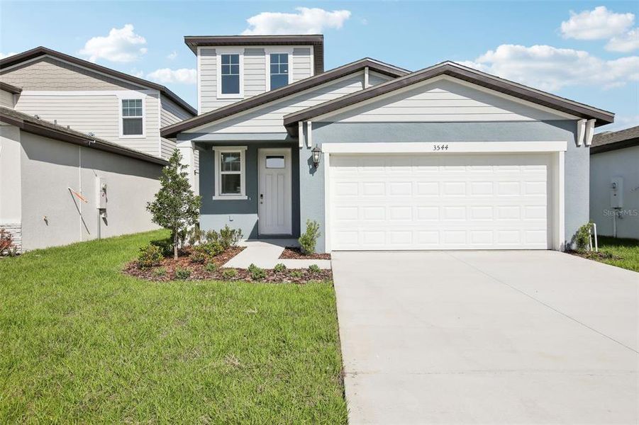 Front exterior of a new home in Benton Hills - Premier Series, Brooksville, FL, highlighting curb appeal (Image 17). Front exterior of a new home in Benton Hills - Premier Series, Brooksville, FL, highlighting curb appeal (Image 17).