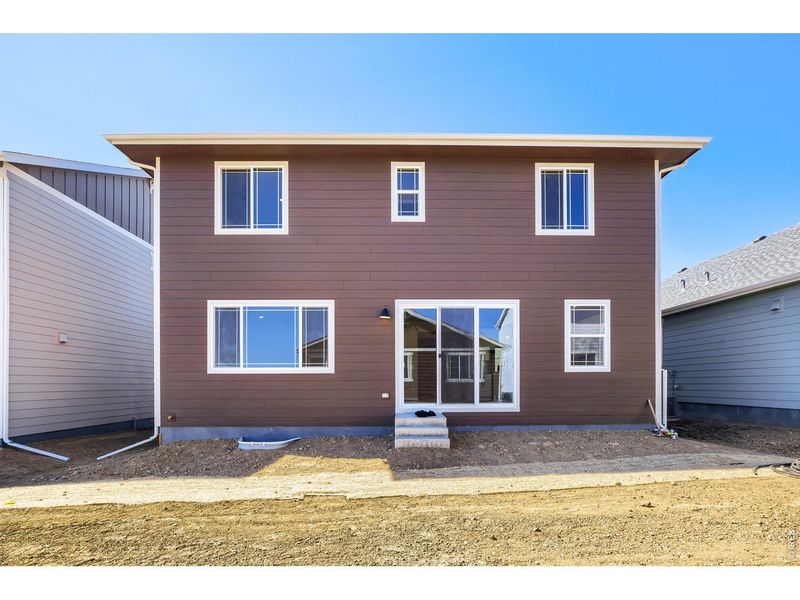 Exterior details and patio area of a home in Farmstead, Berthoud (Image 3).