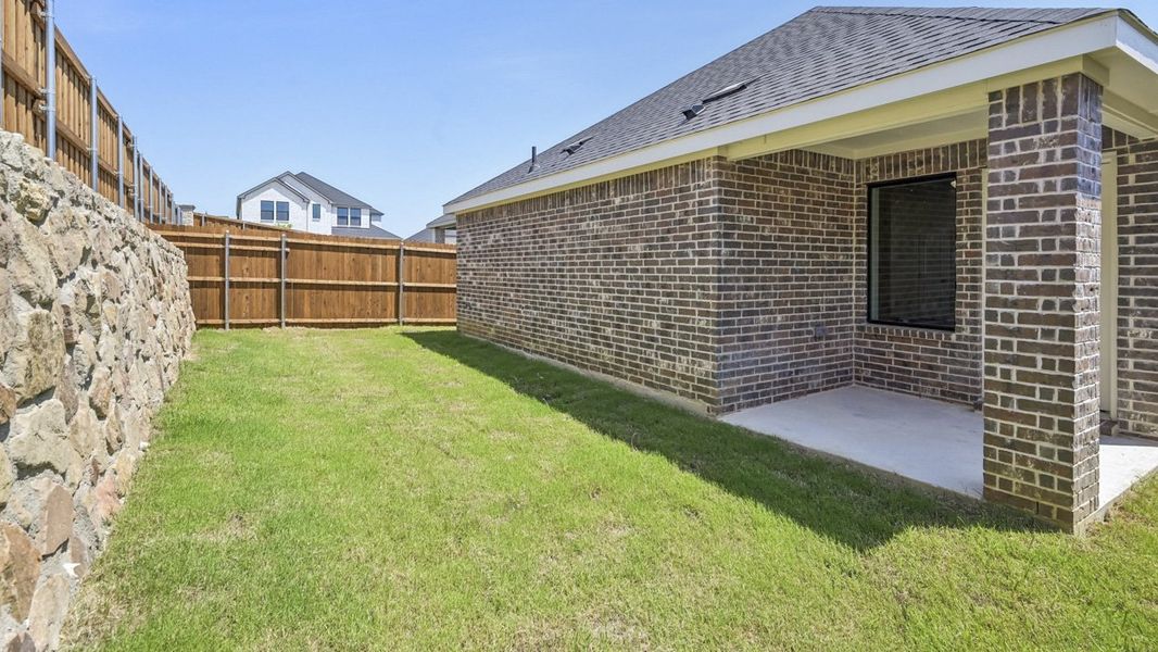 Exterior details and patio area of a home in Windchime, Celina (Image 3).