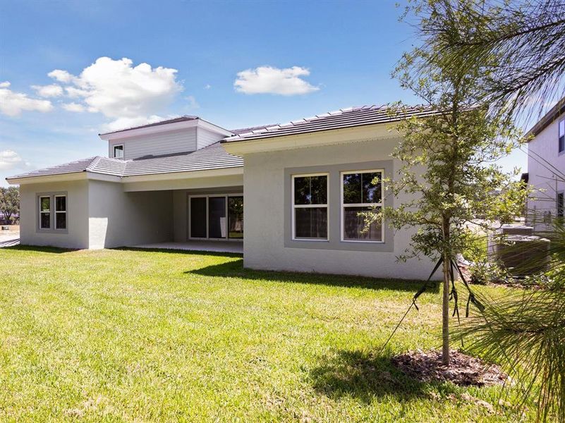 Front exterior of a new home in Crestwood Estates, Valrico, FL, highlighting curb appeal (Image 26). Front exterior of a new home in Crestwood Estates, Valrico, FL, highlighting curb appeal (Image 26).