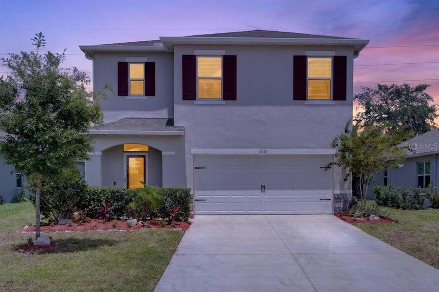 Front exterior of a new home in , Ormond Beach, FL, highlighting curb appeal (Image 2). Front exterior of a new home in , Ormond Beach, FL, highlighting curb appeal (Image 2).