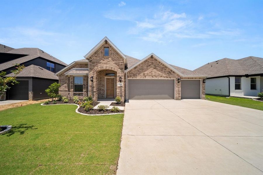 Front exterior of a new home in , Venus, TX, highlighting curb appeal (Image 25).