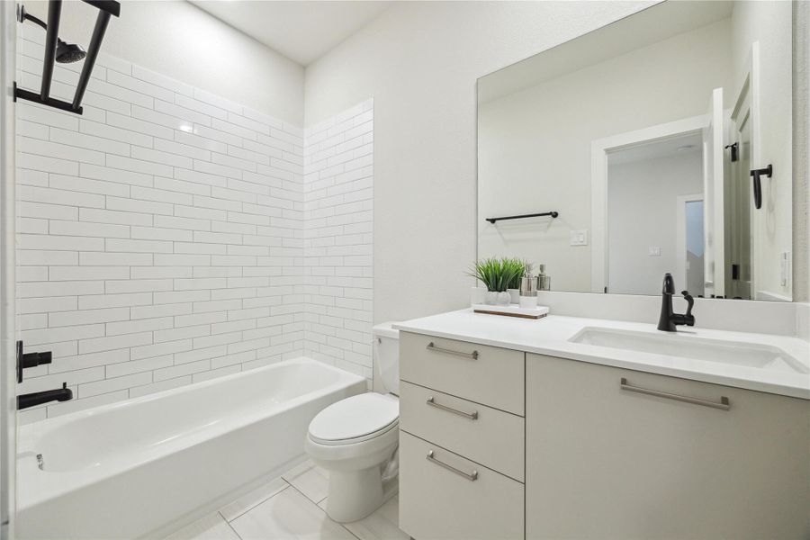 Modern and bright first-floor bathroom featuring sleek finishes and a spacious design.
