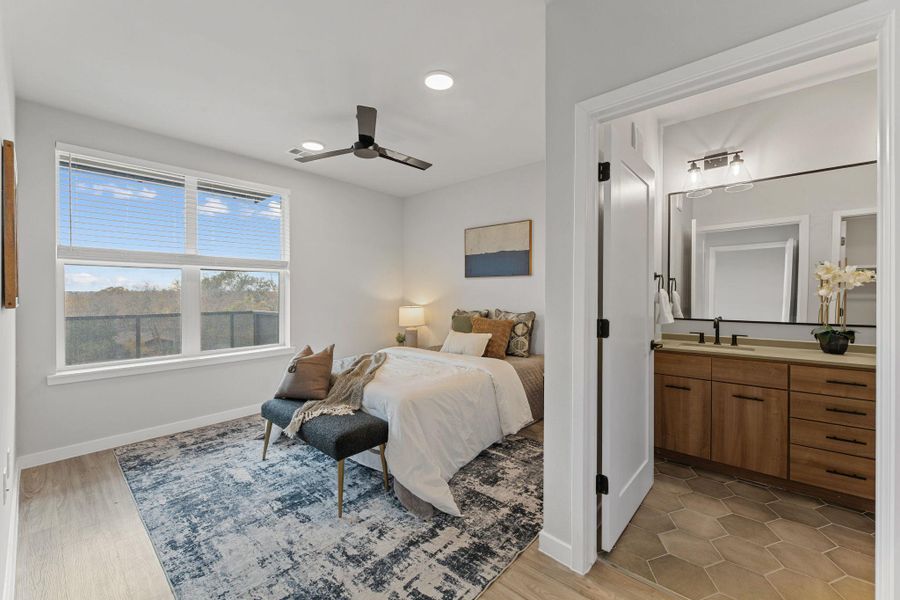 Bedroom featuring a ceiling fan, recessed lighting, and light wood finished floors