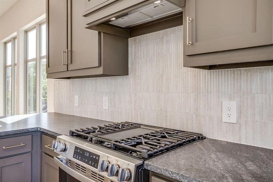 Elegant kitchen interior with rich wood cabinetry and a sophisticated Noir design palette. Elegant kitchen interior with rich wood cabinetry and a sophisticated Noir design palette.