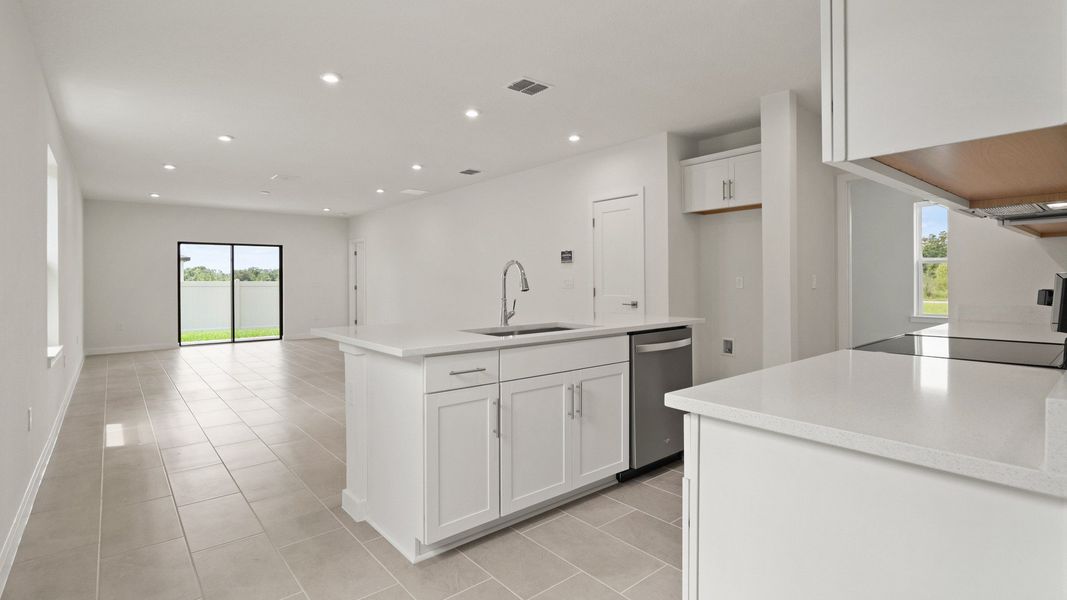 Kitchen Island and view of the living area in the Flagler by DRB Homes in Hamilton Bluff Kitchen Island and view of the living area in the Flagler by DRB Homes in Hamilton Bluff