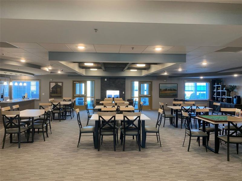 Dining room featuring light carpet and a drop ceiling