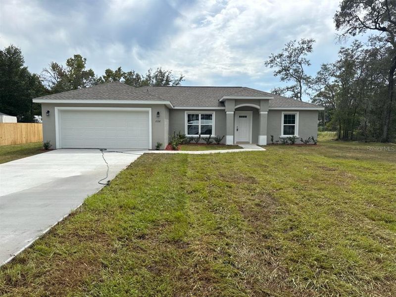 Front exterior of a new home in , Citrus Springs, FL, highlighting curb appeal (Image 1). Front exterior of a new home in , Citrus Springs, FL, highlighting curb appeal (Image 1).