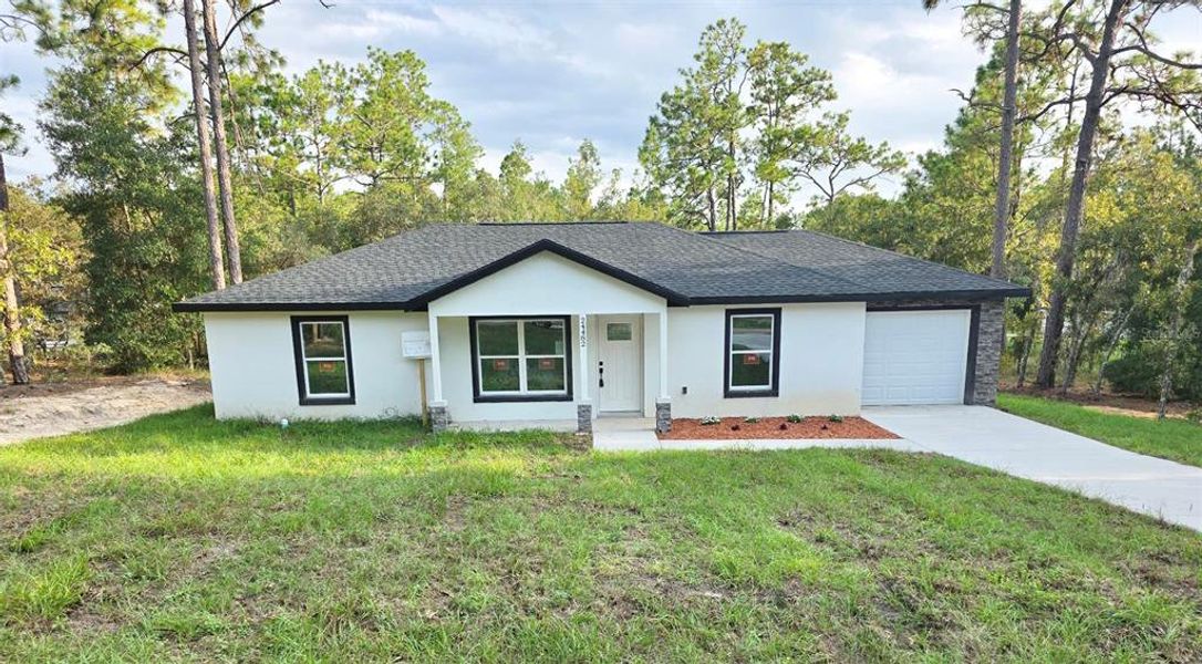 Front exterior of a new home in , Dunnellon, FL, highlighting curb appeal (Image 1). Front exterior of a new home in , Dunnellon, FL, highlighting curb appeal (Image 1).