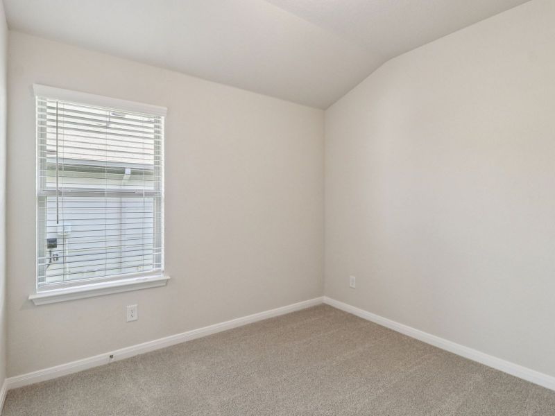 Guest bedroom in the Callaghan floorplan at a Meritage Homes community.