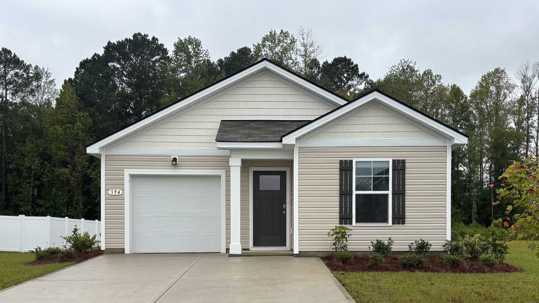 Front exterior of a new home in Heritage Crossing, Conway, SC, highlighting curb appeal (Image 1).