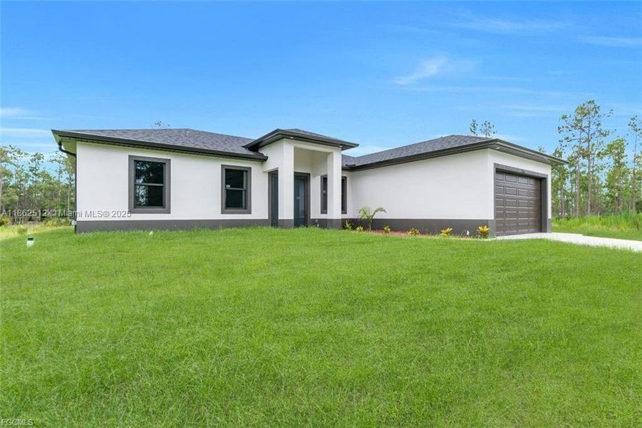 Front exterior of a new home in , Lehigh Acres, FL, highlighting curb appeal (Image 17).