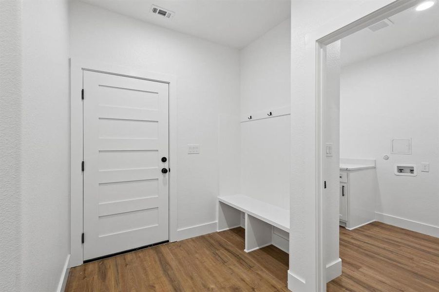 Mudroom featuring hardwood / wood-style floors