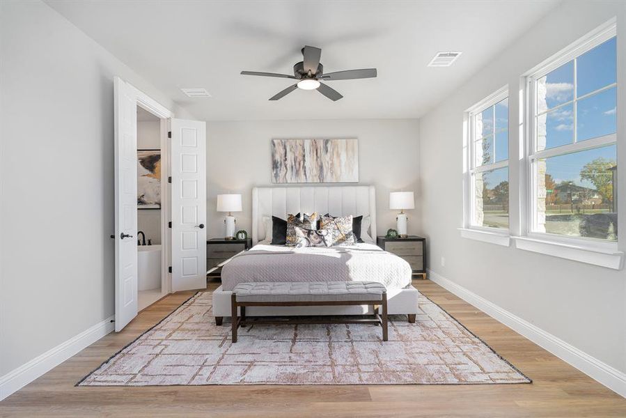 Bedroom featuring ceiling fan and light hardwood / wood-style flooring