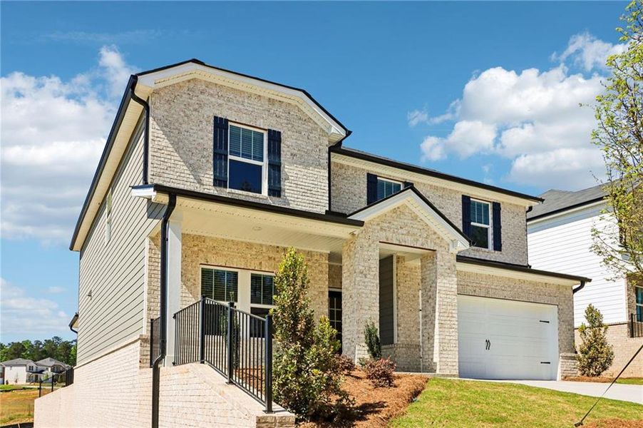 Front exterior of a new home in Harmony Manor, Fairburn, GA, highlighting curb appeal (Image 27). Front exterior of a new home in Harmony Manor, Fairburn, GA, highlighting curb appeal (Image 27).
