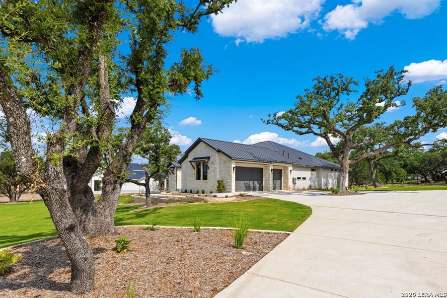 Front exterior of a new home in , Boerne, TX, highlighting curb appeal (Image 23). Front exterior of a new home in , Boerne, TX, highlighting curb appeal (Image 23).