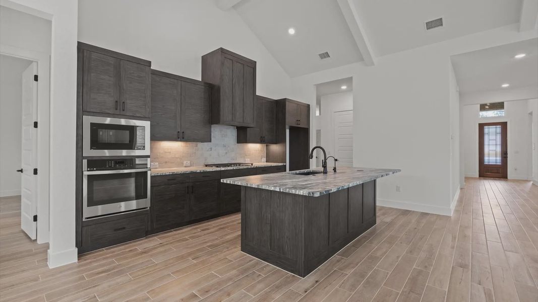 Furnished interior view inside a new home in 6 Creeks, Kyle (Image 5).