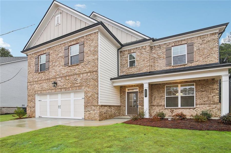 Front exterior of a new home in Pinecrest Ridge, Dacula, GA, highlighting curb appeal (Image 21). Front exterior of a new home in Pinecrest Ridge, Dacula, GA, highlighting curb appeal (Image 21).