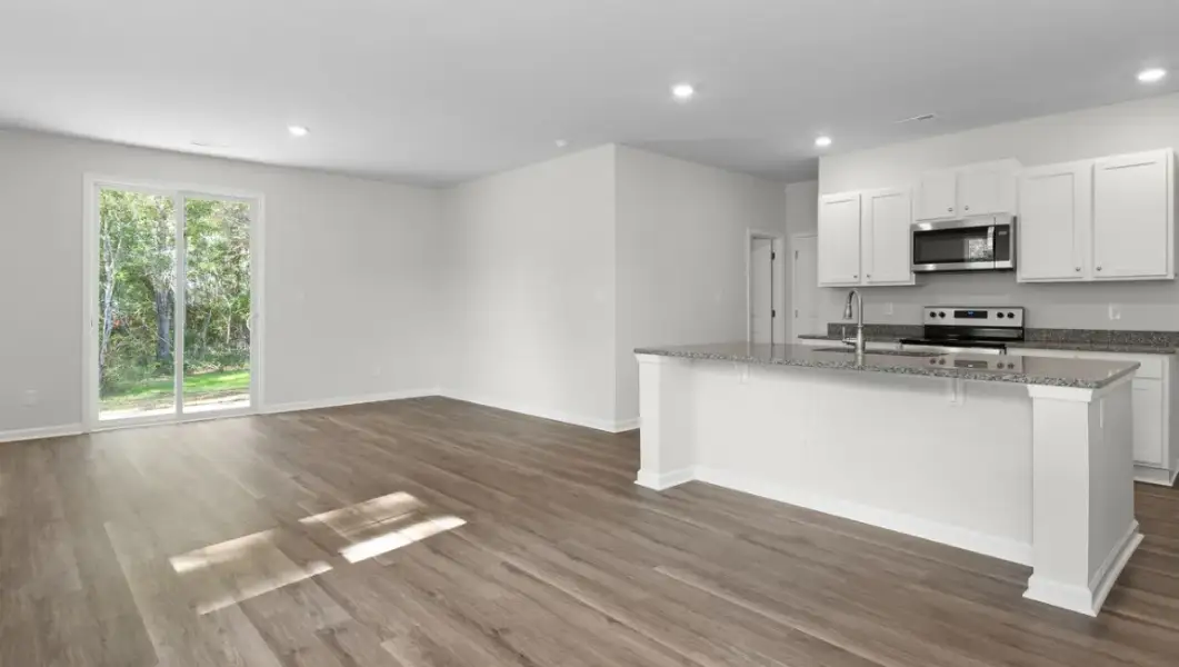Spacious, unfurnished interior of a new home in The Highlands at Cedar Hill Landing, Navassa (Image 13).