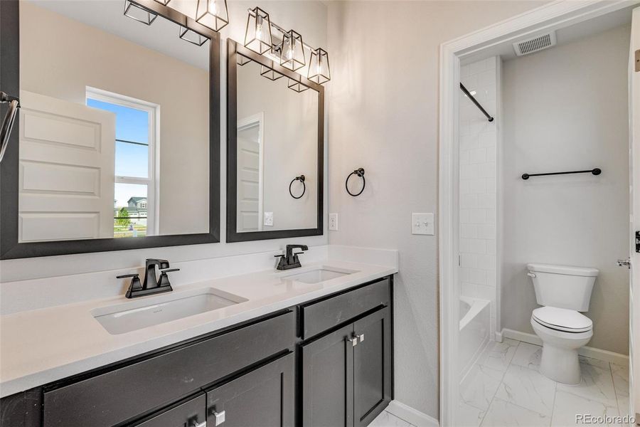 Furnished interior view inside a new home in Crescendo at The Aurora Highlands, Aurora (Image 9).