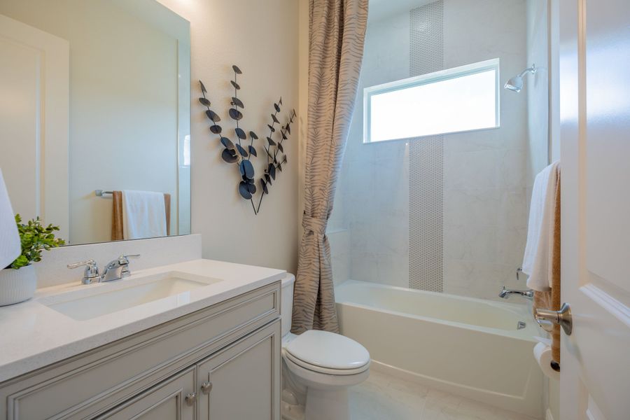 Representative furnished interior of a home built from the Ibis by Jones Homes USA in Legends Preserve, Daytona Beach (Image 7).