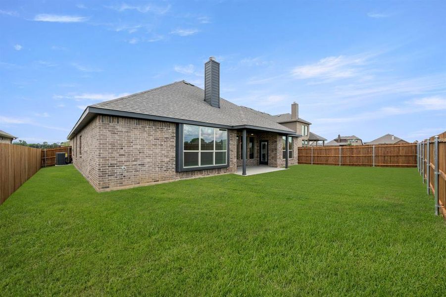 Exterior details and patio area of a home in Mockingbird Hills, Joshua (Image 4).