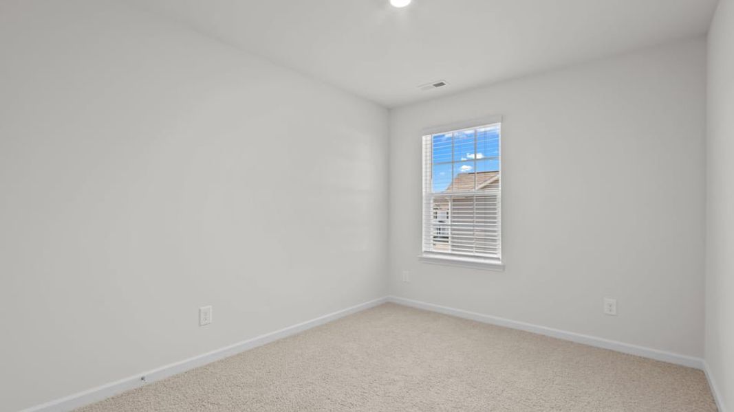 Spacious, unfurnished interior of a new home in The Townes at Ridgewood Farms, Winterville (Image 29).