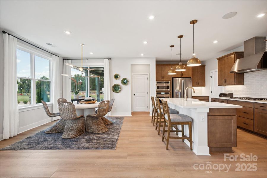Huge windows let light in and keep the cold and heat out. This connected space flows seamlessly together. *Model Photos | actual finishes, structural selections, and orientation may vary.