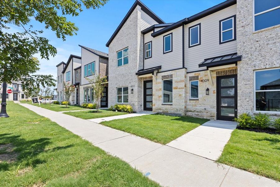 Front exterior of a new home in , Rowlett, TX, highlighting curb appeal (Image 1).