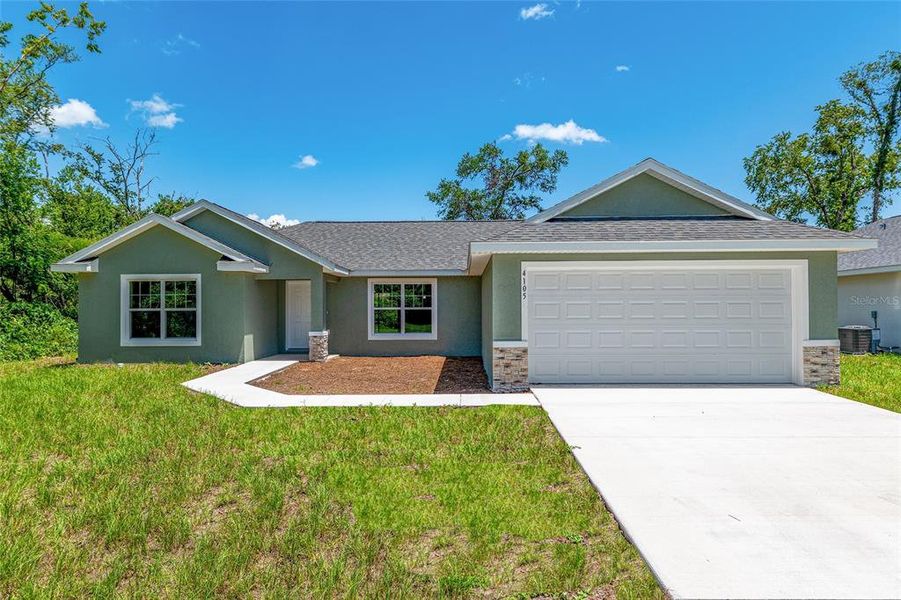 Front exterior of a new home in , Dunnellon, FL, highlighting curb appeal (Image 14).