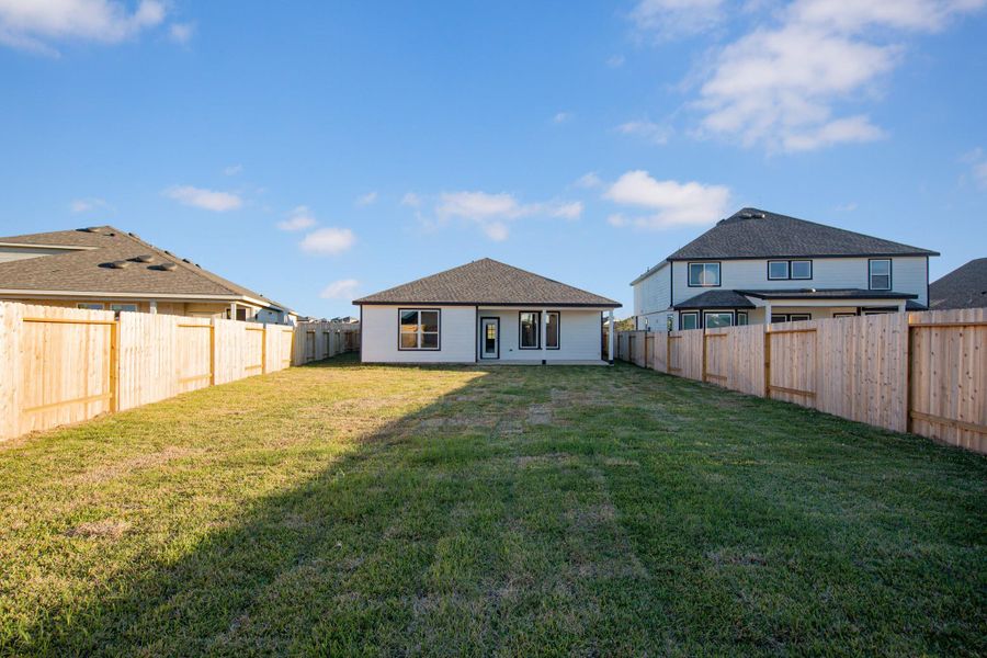 Exterior details and patio area of a home in Bluestem, Brookshire (Image 2).